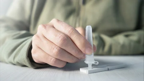 Person using sars cov 2 antigen testing card. Rapid diagnose home test. Stock Footage 170629716