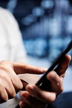 Person using smartphone with blurred background 스톡 사진
