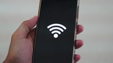 Person using smartphone to connect to wireless internet with wifi Stock Footage 328645980