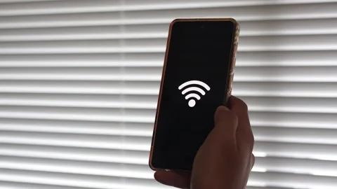 Person using smartphone to connect to wireless internet with wifi Stock Footage 328646303