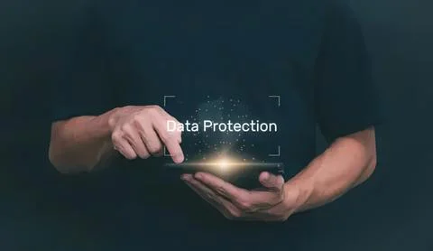 Person using a smartphone with data protection text Stock Photos