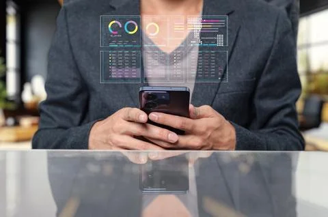 Person using smartphone with data visualization elements on display Stock Photos