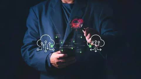 Person using smartphone with digital cloud icons in dark Stock Photos