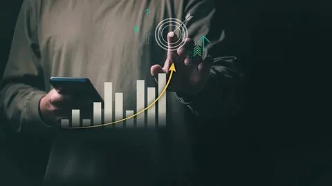Person using smartphone with digital graph and data icons Stock Photos