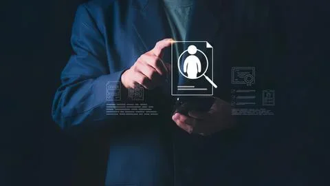 Person using a smartphone with digital profile icon Stock Photos