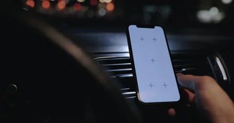 Person using smartphone with empty screen in a car, tap and zoom out gesture Stock Footage 331571550
