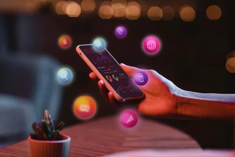 Person using a smartphone with glowing app icons, modern technology concept Illustrazione stock