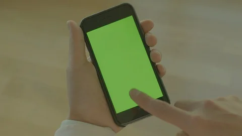 Person using a smartphone (green screen) Stock Footage 127110102