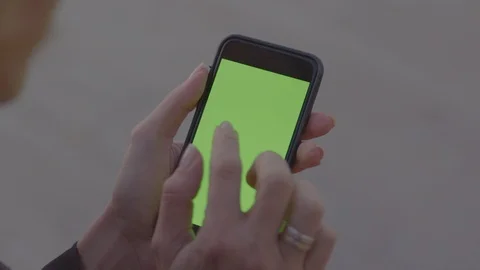 Person using a smartphone (green screen) Stock Footage 127110311