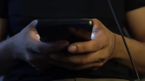 Person using smartphone at night while traveling Stock Footage 320968348