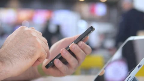 Person using smartphone in public space Stock Footage 341495483