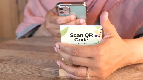 Person using smartphone to scan QR code for restaurant menu. Stock Footage 333031746