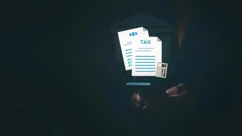 Person using smartphone with tax documents and calculator Stock Photos