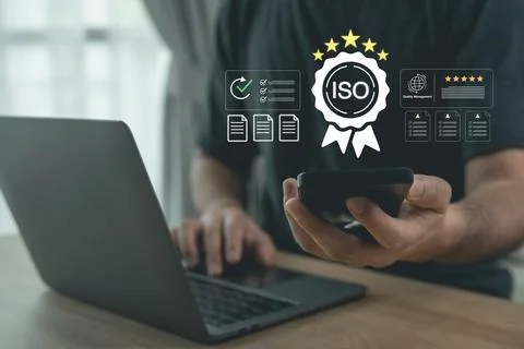 Person using smartphone with virtual ISO quality management certification a.. Stockfoto's