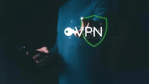 Person using smartphone with vpn shield icon on screen Stock Photos