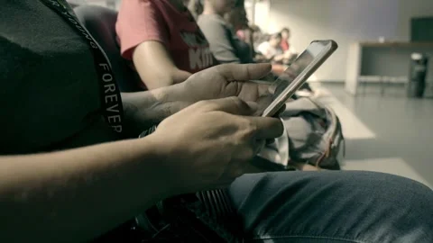 Person Using Smartphone While Attending Seminar in Indoor Conference Hall Stock Footage 336466374