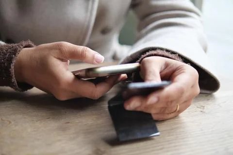 Person using a smartphone while scan the qr code to find the cafe menu 库存照片