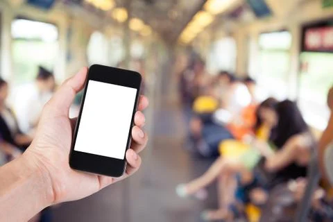 Person using smartphone white screen holder on hand with blurry background of Stock Photos