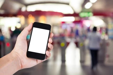 Person using smartphone white screen holder on hand with  blurred background  Stock Photos
