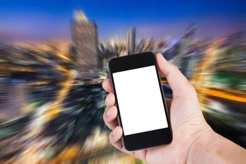 Person using smartphone white screen holder on hand with blurry background of Stock Photos