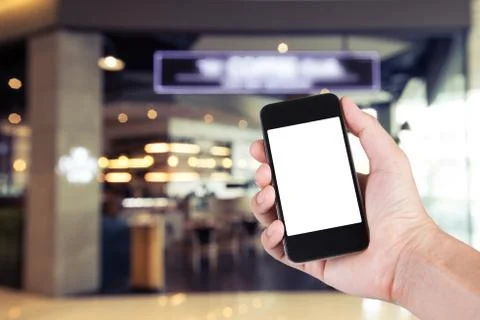 Person using smartphone white screen holder on hand with blurry background of Stock Photos