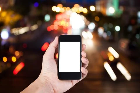 Person using smartphone white screen holder on hand with blurry background bo Stock Photos