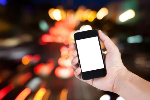 Person using smartphone white screen holder on hand with blurry background bo Stock-Fotos