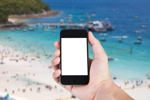 Person using smartphone white screen holder on hand with blurry background of Stock Photos