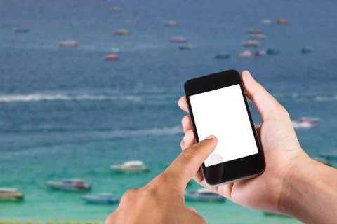 Person using smartphone white screen holder on hand with blurry background of Stock Photos