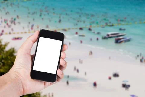 Person using smartphone white screen holder on hand with blurry background of 写真素材