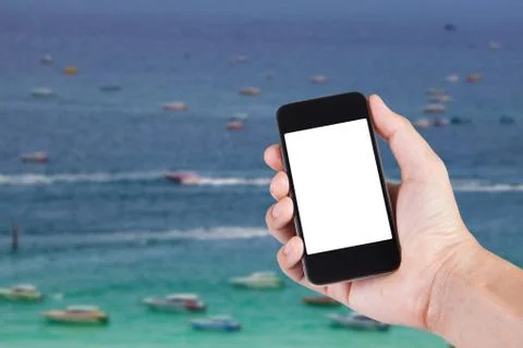 Person using smartphone white screen holder on hand with blurry background of Stock Photos