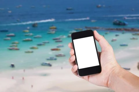 Person using smartphone white screen holder on hand with blurry background of Stock Photos