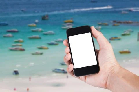 Person using smartphone white screen holder on hand with blurry background of Stock Photos