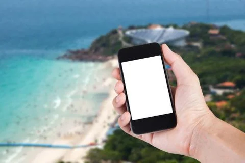 Person using smartphone white screen holder on hand with blurry background of 写真素材