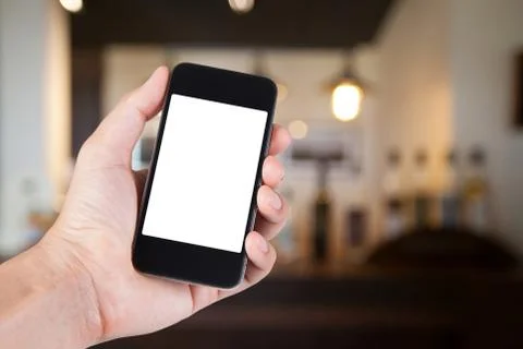 Person using smartphone white screen holder on hand with blurry background of Stock Photos