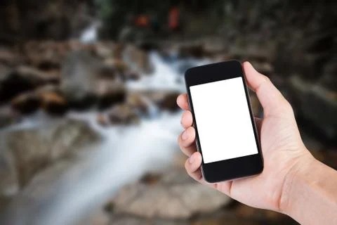 Person using smartphone white screen holder on hand with blurry background of Stock Photos
