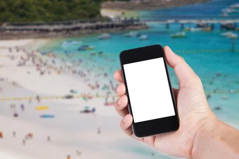 Person using smartphone white screen holder on hand with blurry background of Stock Photos