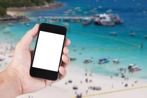 Person using smartphone white screen holder on hand with blurry background of 写真素材
