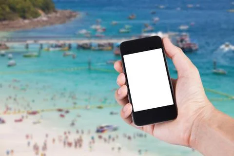 Person using smartphone white screen holder on hand with blurry background of Stock Photos