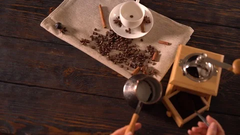 Person using spoon to scoop ground coffee into pot Stock-Footage 94462922