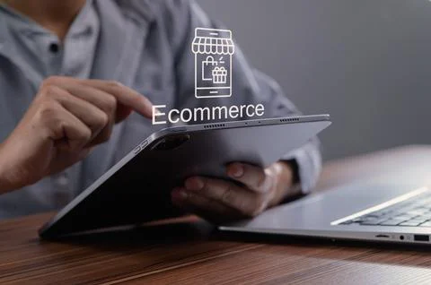 Person Using Tablet to Access E-commerce Shopping Experience Stock Photos