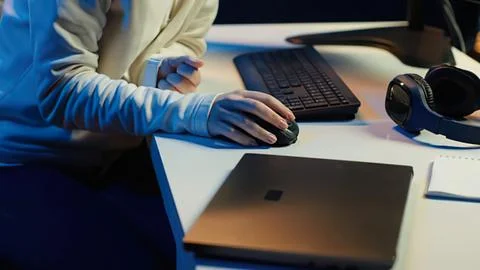 Person using tablet and laptop at workspace Stock Photos