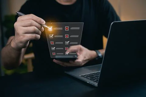 Person Using Tablet with Checklist and Laptop Displaying Productivity Tools.. Stock-Fotos