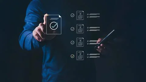 Person using tablet with checklist and documents Stock Photos
