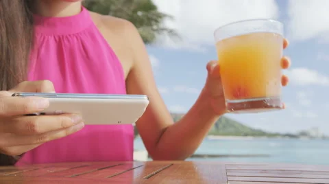 Person using tablet computer wireless smart device at beach bar 스톡 동영상 48241220