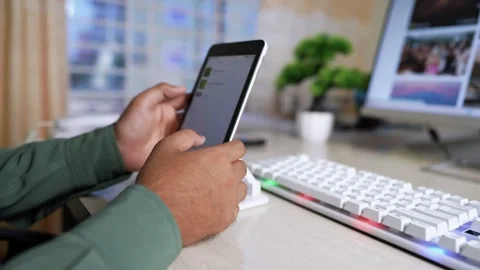 Person Using Tablet at Desk with Keyboard and Monitor Stock Footage 316799984