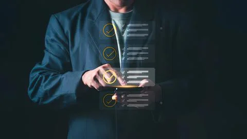Person using tablet with digital checklists and icons Stock Photos