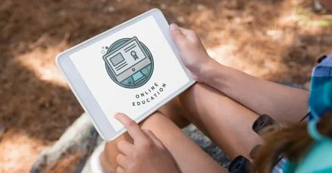 Person using a tablet with e-learning information in the screen Stock Photos