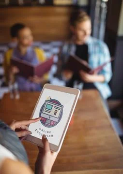 Person using a tablet with e-learning information in the screen Stock Photos