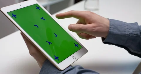 A Person Using A Tablet With Green Screen For Chroma Key Stock Footage 104742840